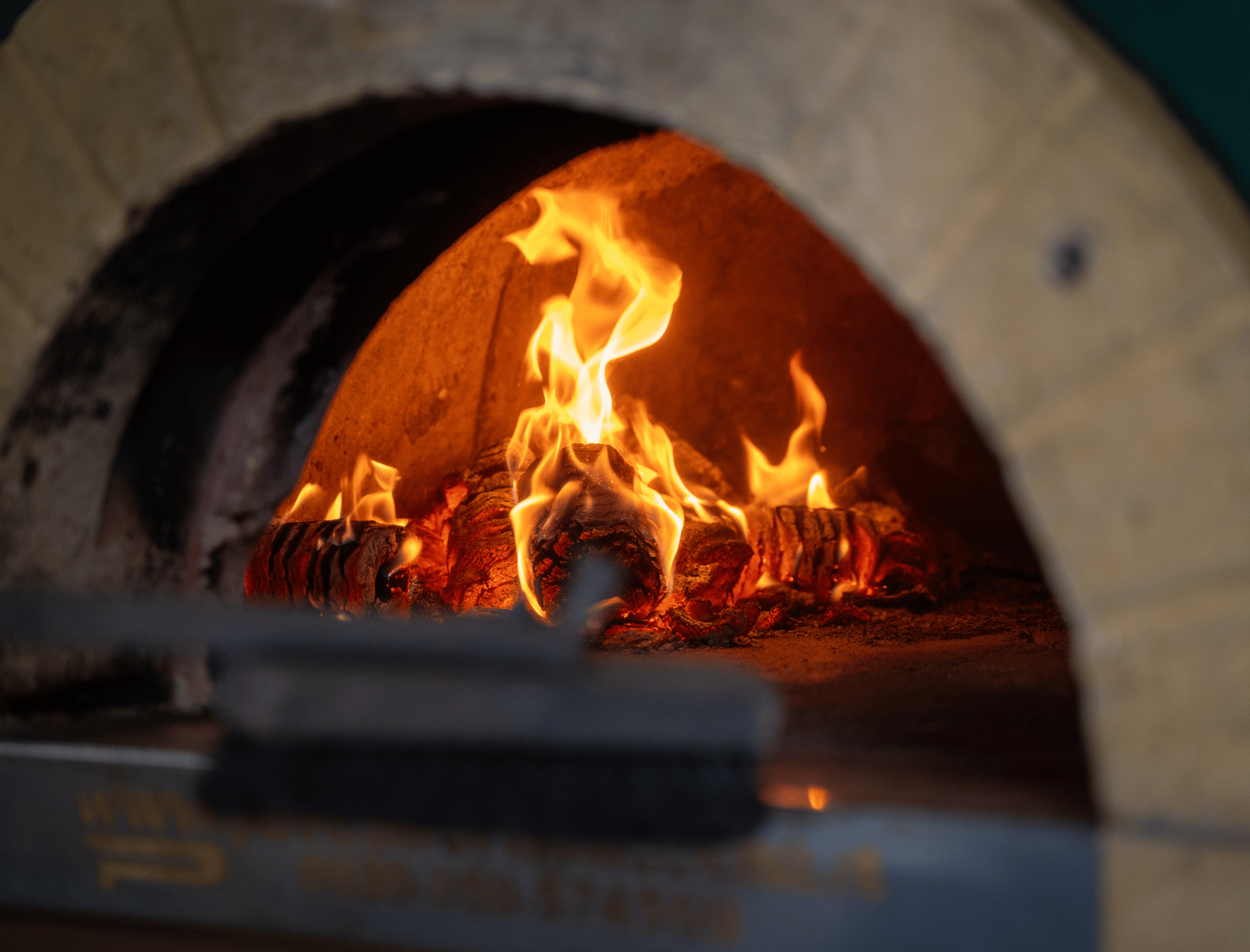 Wood-fired oven with flames inside